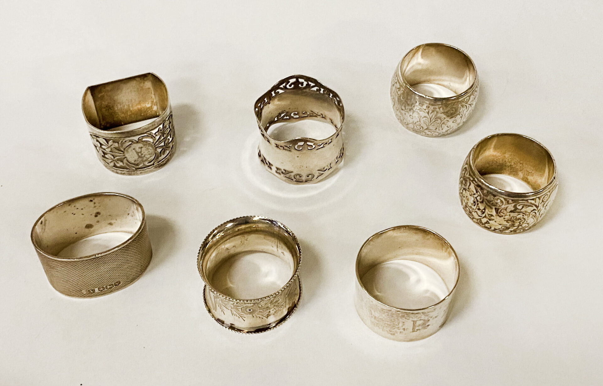 SEVEN HM SILVER NAPKIN RINGS 9OZS APPROX Southgate Auction Rooms